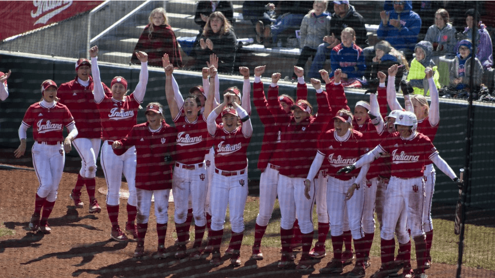 The IU softball team awaits Grayson Radcliffe on March 17 after she hits a grand slam against Saint Francis University. IU lost against Michigan on April 7, 7-6.