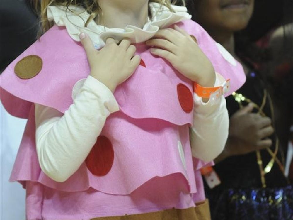 Tom Crean's daughter joins the costume parade as a cupcake at the Haunted Hall of Hoops on Saturday Oct. 29, 2011 at Assembly Hall.