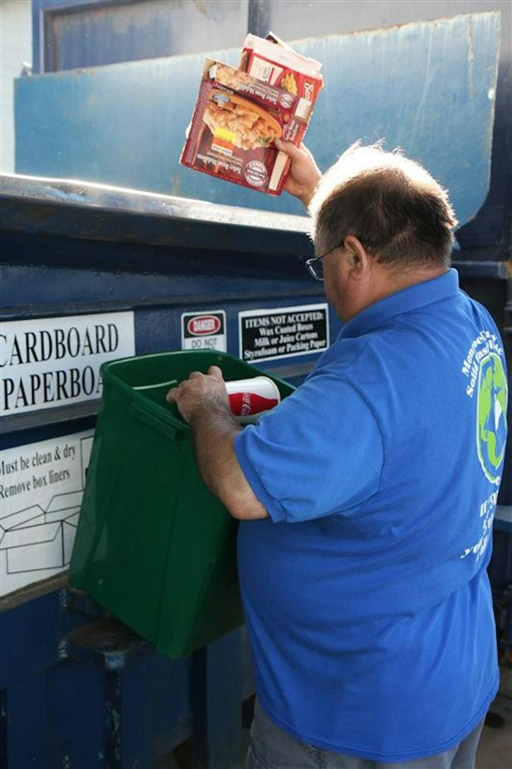 Chris Kearns, a supervisor at Monroe County Solid Waste Management's Recycling Center sorts cardboard dropped off by a Monroe County resident  on Sept. 13, 2008 at the Bloomington location. The center is located on South Walnut St., and accepts most material collected by rural pickup in addition to hazardous materials.