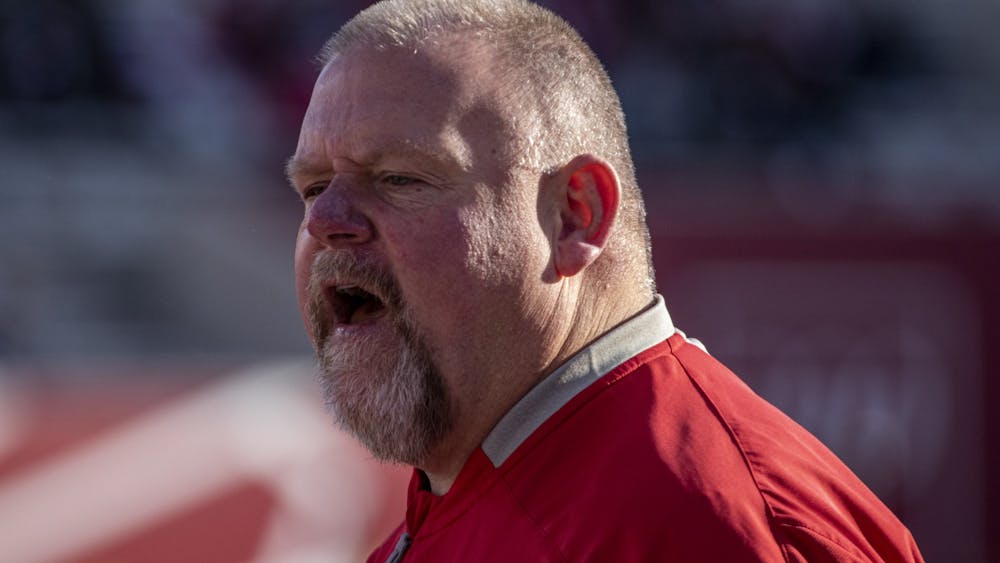 Then-Indiana offensive line coach Darren Hiller yells during a drill prior to Indiana&#x27;s football game against Minnesota on Nov. 20, 2021, at Memorial Stadium. Hiller was fired Sunday after coaching for six seasons at Indiana.