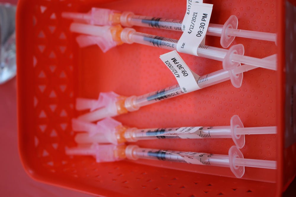 <p>COVID-19 vaccinations appear in a tray on April. 12, 2021, at a Simon Skojdt Assembly Hall vaccine clinic. A new COVID-19 PCR testing site will open at 500 N. Profile Parkway on Tuesday, Monroe County health administrator Penny Caudill said Friday during a press conference.</p>