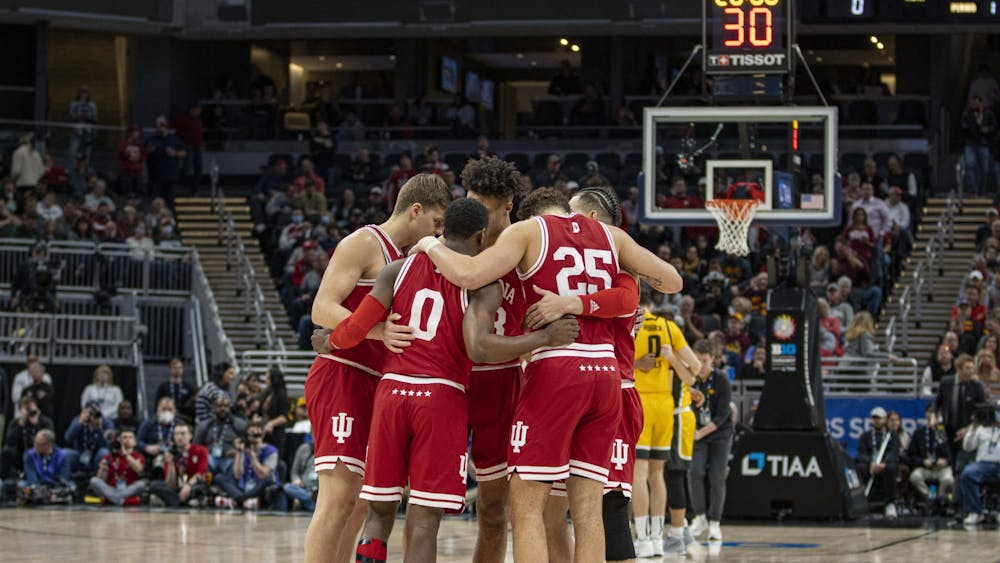 The Indiana starters huddle prior to the start of their game against Iowa on March 12, 2022, at Gainbridge Fieldhouse. Indiana fell to Iowa in the Big Ten Tournament semifinals 80-77.