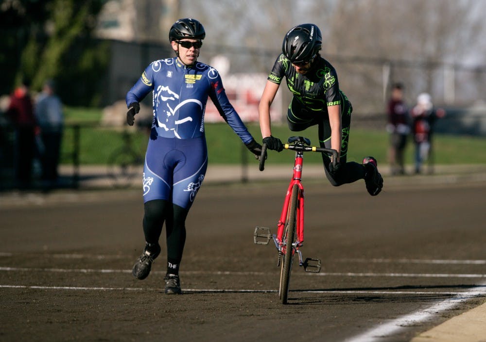 Kappa Alpha Theta riders perform an exchange during Little 500 qualifications Saturday morning at Bill Armstrong Stadium. Kappa Alpha Theta finished first in quals. with a time of 2:36.63.