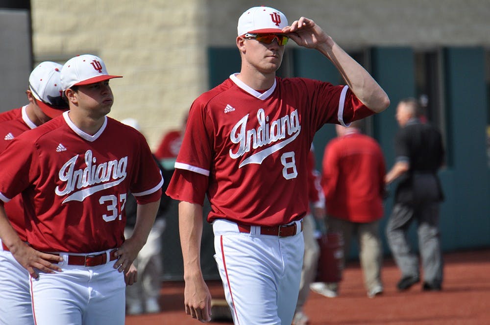 Pitchers Evan Bell (right) and Scott Effross (left) walk towards home plate to shake hands with the Michigan team after their loss in game 3 on Sunday at Bart Kaufmann Field. The Hoosieer's ended their weekend series against Michigan 1-2.