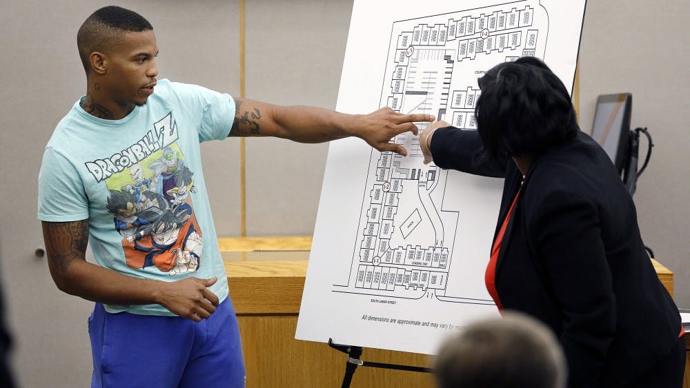 Joshua Brown points to a map to answer a question from Assistant District Attorney LaQuita Long Sept. 24 in Dallas. He lived across the hall from Botham Jean, who was shot and killed by an off-duty officer thinking he was in her apartment.