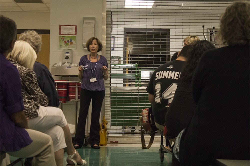 Kathy Hewett, Lead Health Educator and Accreditation coordinator for the Monroe County Health Department,speaks with members of the community at a Monroe County Health Converation at Tri-North Middle School on Tuesday.