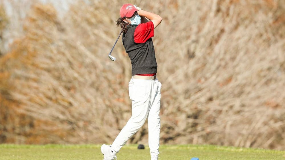 Then-freshman Clay Merchent swings a golf club Feb. 15, 2021, during the Mobile Bay Intercollegiate. Indiana will compete in the Big Ten Championships in French Lick, Indiana, from Friday to Sunday.