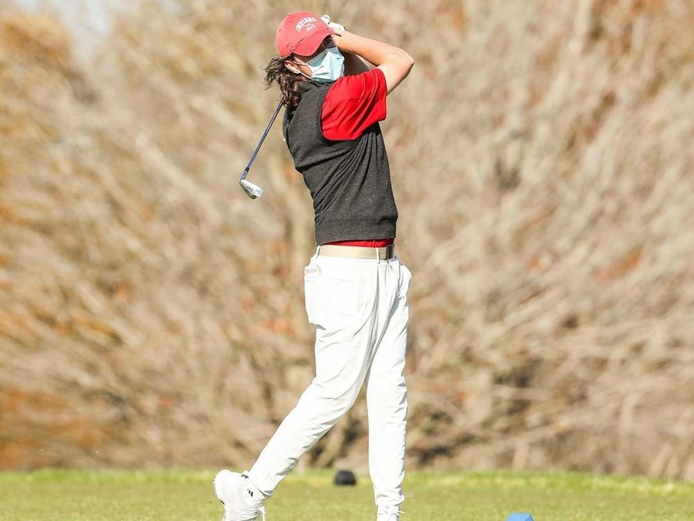 Then-freshman Clay Merchent swings a golf club Feb. 15, 2021, during the Mobile Bay Intercollegiate. Indiana will compete in the Big Ten Championships in French Lick, Indiana, from Friday to Sunday.