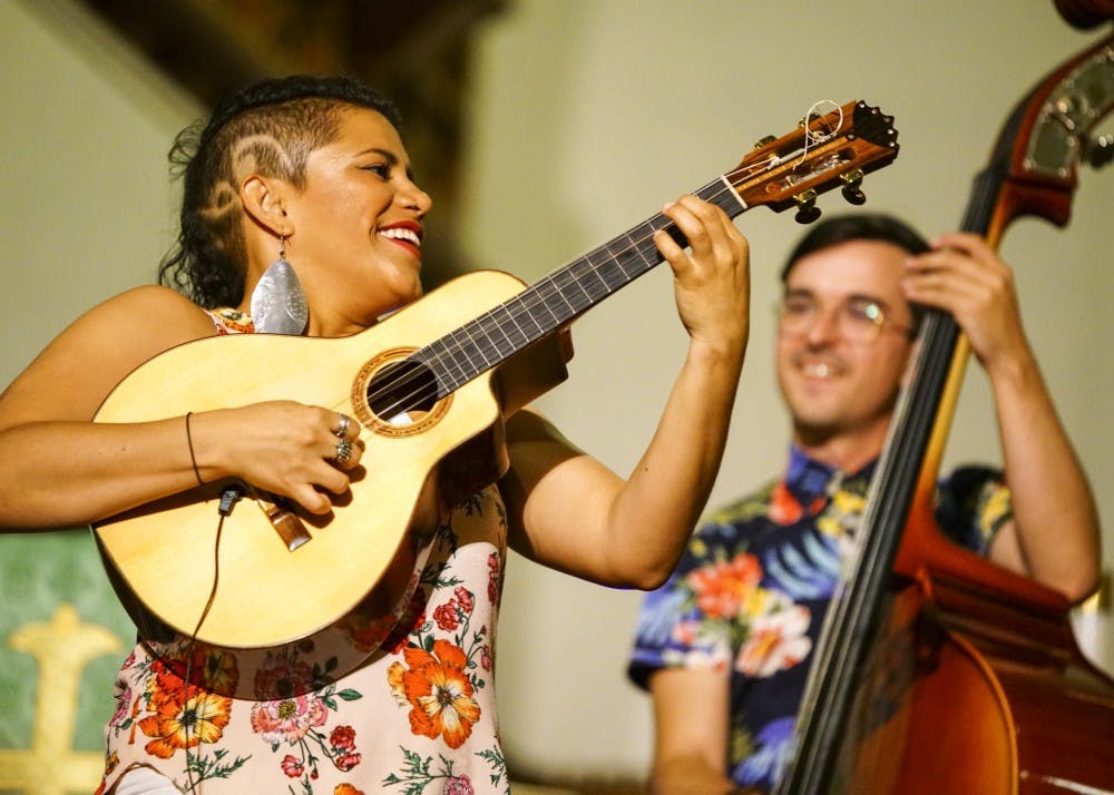 Mafer Bandola of Ladama plays a solo on the bandola llanera during the Lotus World Music and Arts Festival Saturday night in the First United Methodist Church. Ladama specializes in Pan-American music combining the styles of traditional Brazilian, Venezuelan and Colombian music with contemporary American pop and jazz.