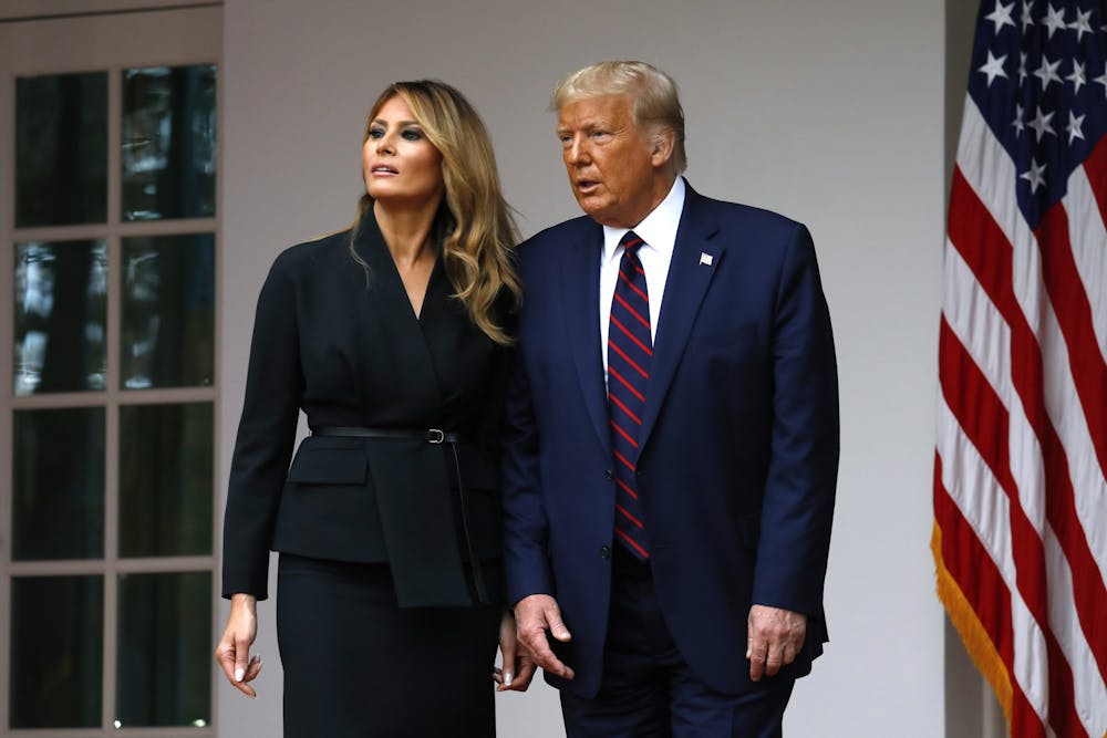 <p>President Donald Trump departs with first lady Melania Trump after introducing Judge Amy Coney Barrett as his Supreme Court Associate Justice nominee Sept. 26 in the Rose Garden of the White House in Washington, D.C. President Trump and Melania Trump tested positive for the coronavirus late Thursday night after being exposed to a staffer who contracted the virus.</p>