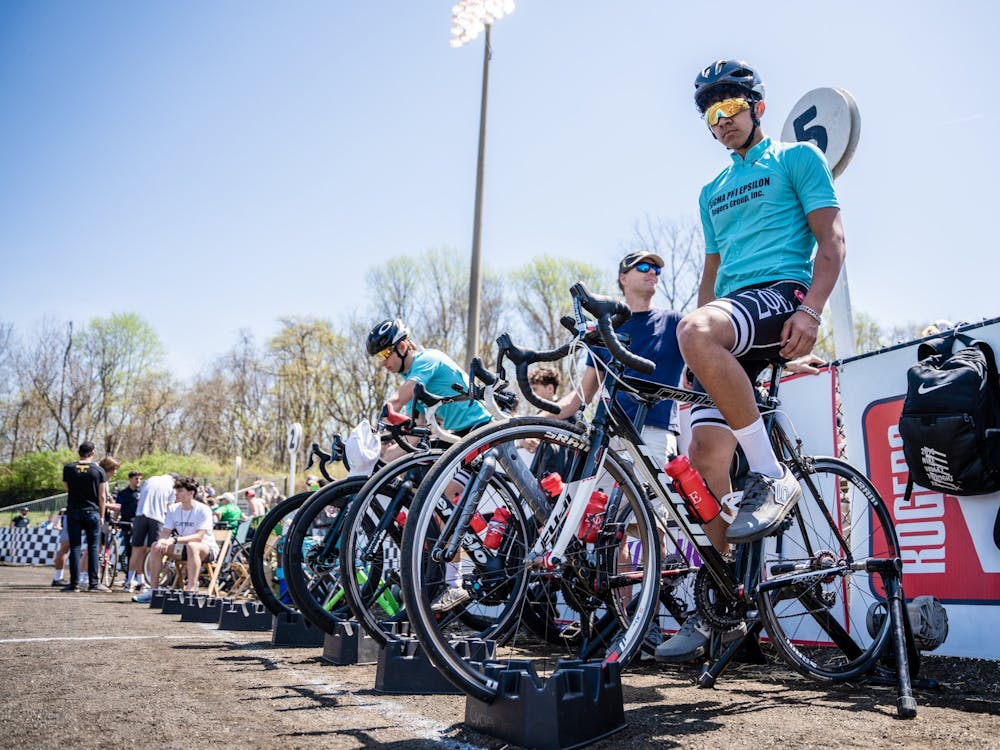 Riders from the Sigma Phi Epsilon team warm up before heading out for practice laps at the Men&#x27;s Little 500 April 23, 2022, at Bill Armstrong Stadium.