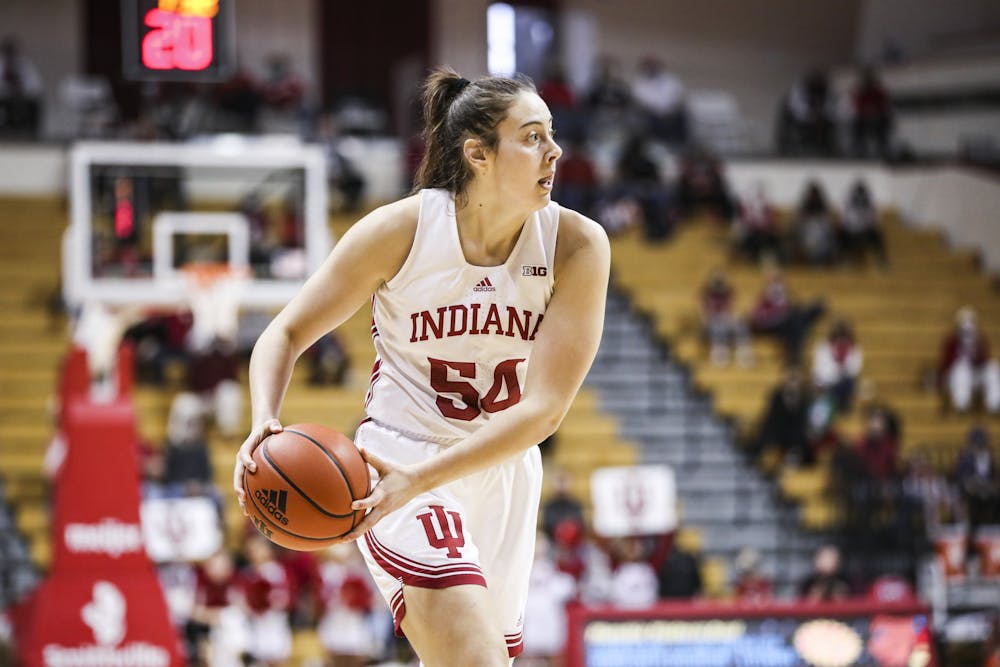 Junior forward Mackenzie Holmes looks to pass the ball against Southern Illinois University on Thursday at Simon Skjodt Assembly Hall. Holmes scored 18 points for the Hoosiers.  