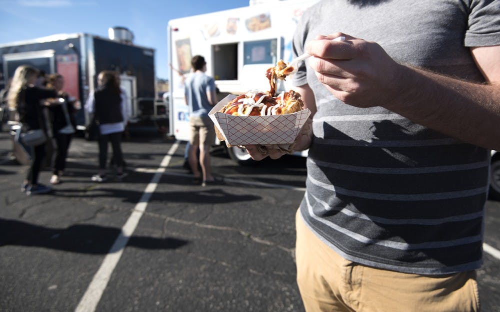 Food truck friday brought a variety of different food trucks to the First United Methodist Church including Juancho’s Munchies, La Poblana, Urgent Foods and The Chocolate Moose. Customers listened to the student DJ as they ate barbeque potatoes and tacos out of to-go containers. 