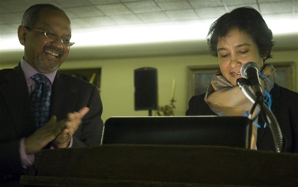 IU Professor and Director of India Studies Sumit Ganguly applauds author and women's rights advocate Taslima Nasrin after she spoke about her life and read one of her poems Friday evening in the IMU University Club Faculty Room. In the lecture, titled "My Life: A Struggle for Equality," Nasrin, a Bengali exile and award-winning author explained her persistent fight for women's rights in the face of death threats and beatings from Islamic extremists, expulsion from her homeland and India and her longing to return to Bangladesh.