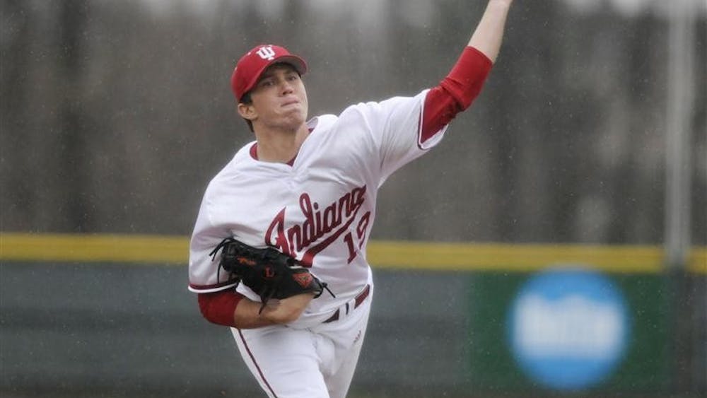 IU's Matt Bashore throws to a Chicago State batter during a game in the rain March 31 at Sembower Field.