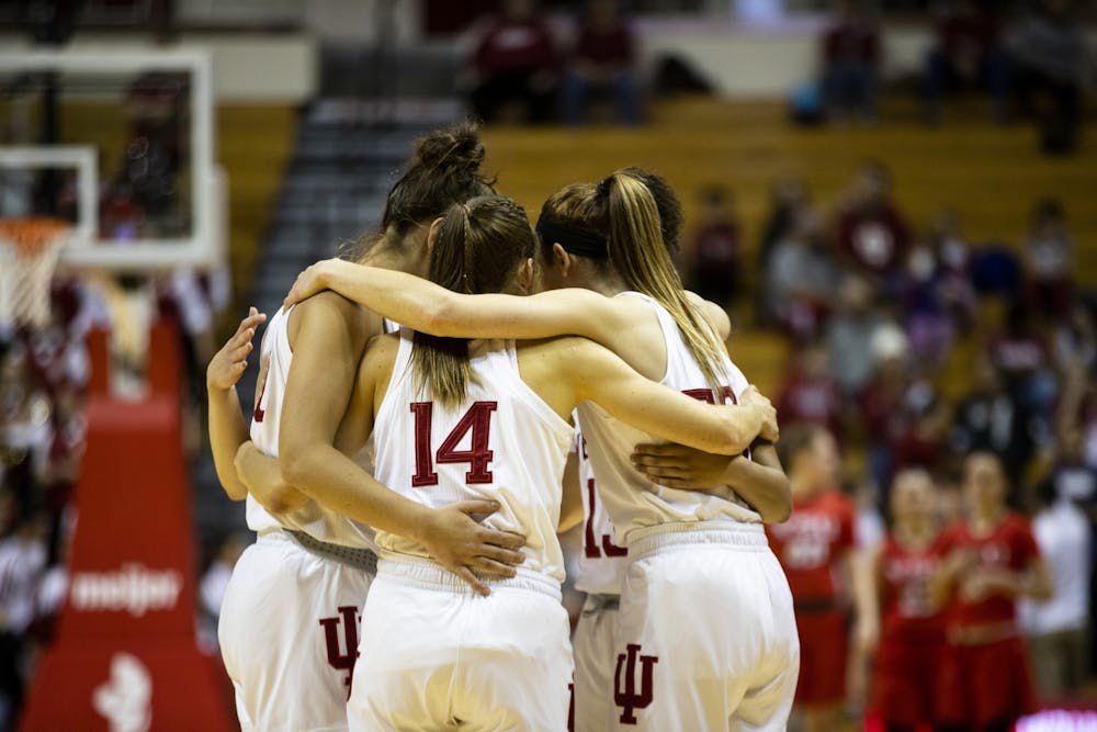 <p>IU women’s basketball huddles up before their game Dec. 15 at Simon Skjodt Assembly Hall. No. 12 IU beat Youngstown State University 93-56. </p>