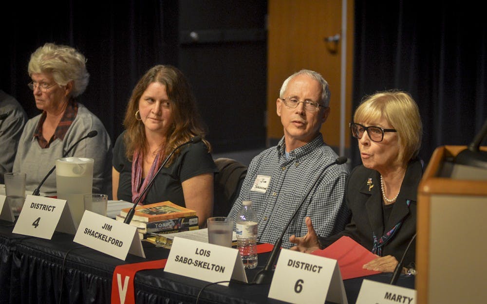 District 6 candidates Lois Sabo-Skelton and Marty Spechler debate on the topic of charter schools and their effects on public school funding during the Monroe County Community School Corporation meeting Thursday evening at the Monroe County Public Library.