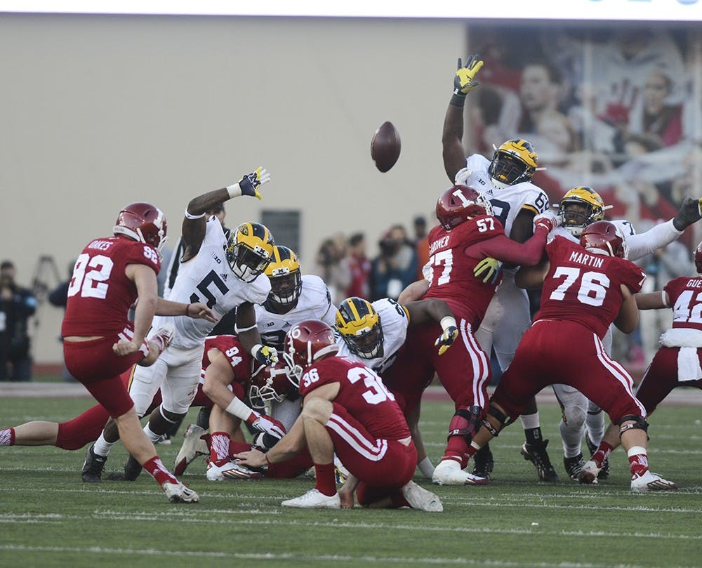 Kicker Griffin Oakes kicks a 51-yard field goal during the against Michigan on Saturday at Memorial Stadium. The Hoosiers lost in double overtime, 41-48.