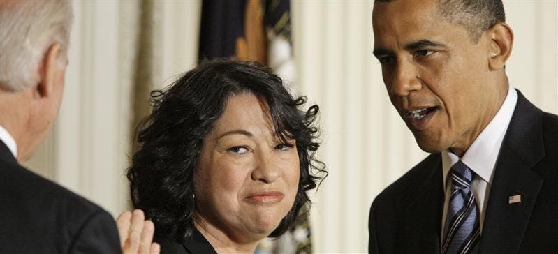 Vice president Joe Biden, left, and President Barack Obama, right, stand with Judge Sonia Sotomayor on Tuesday in the East Room of the White House in Washington. Obama announced her nomination to the Supreme Court.