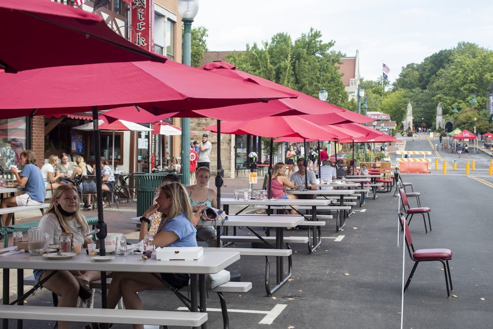 <p>Restaurant customers sit at tables Aug. 29, 2021, on Kirkwood Avenue. The Expanded Outdoor Dining Program will extend from March 16 through Nov. 1. </p>