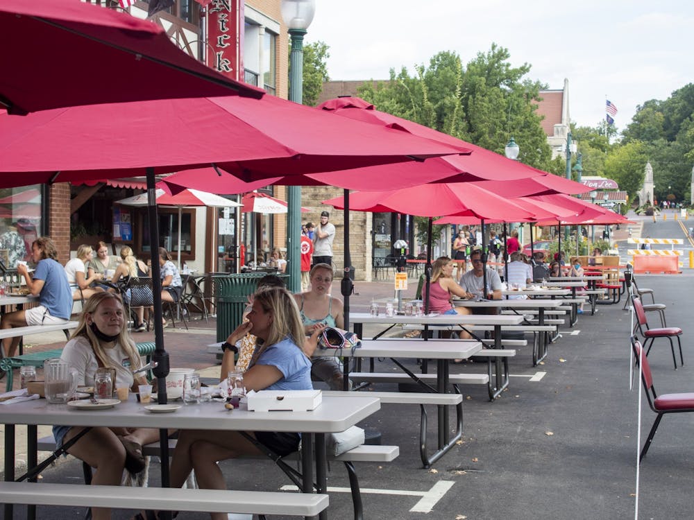 Restaurant customers sit at tables Aug. 29, 2021, on Kirkwood Avenue. The Expanded Outdoor Dining Program will extend from March 16 through Nov. 1. 