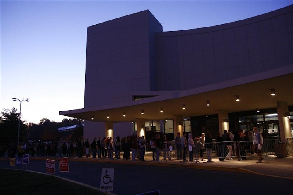 Voters stand in line early Tuesday morning outside Assembly Hall, waiting to vote in Bloomington's 3rd and 17th precincts.
