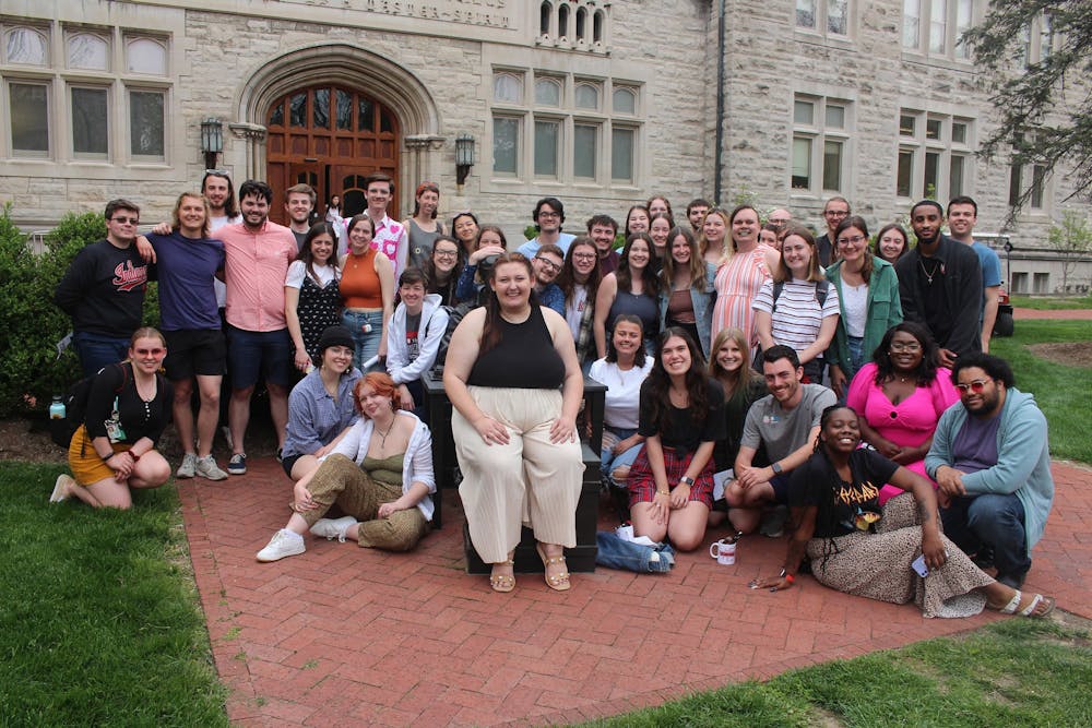 <p>The spring 2022 staff of the IDS pose April 24, 2022, outside Franklin Hall with the Ernie Pyle Statue. The newsroom brought home a slew of national awards last weekend. </p>