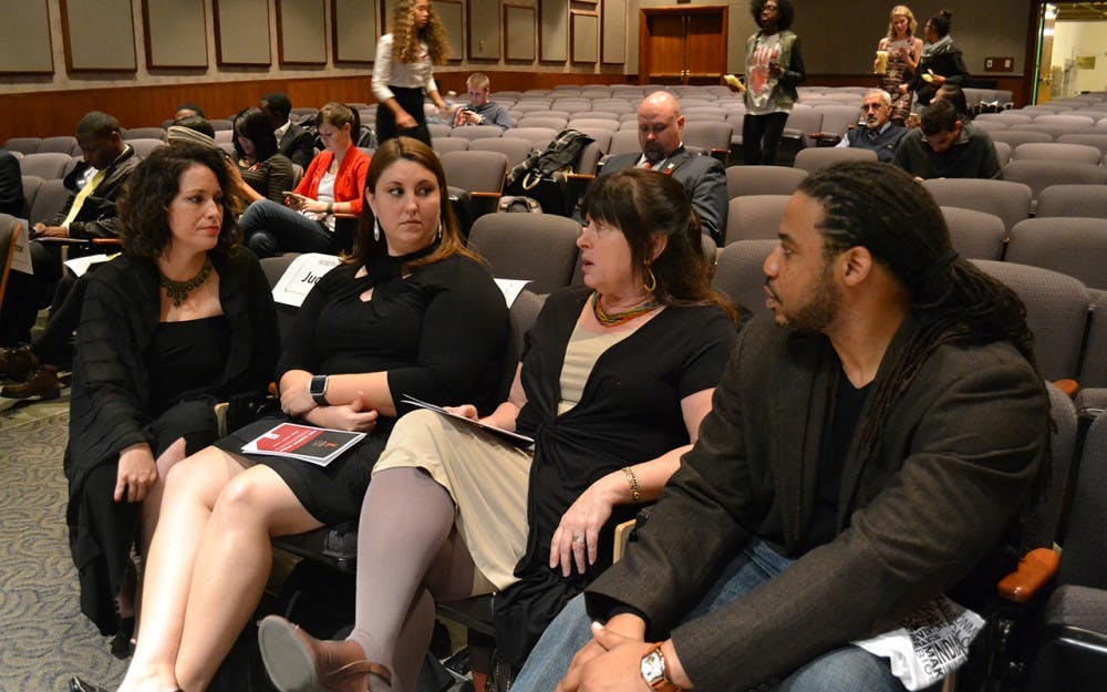 The judges of the HIV/AIDS PSA Contest discuss before the screening. This event was held in the IMU on Tuesday evening.