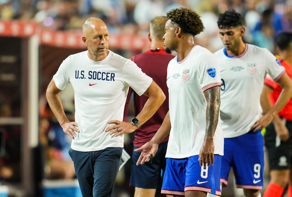 United States head coach Gregg Berhalter talks with midfielder Weston McKennie (8) during the second half of a Copa America match against Uruguay on July 1, 2024, at Arrowhead Stadium in Kansas City, Missouri. Berhalter and the United States Men's National Team failed to advance to the quarterfinals in Copa America.