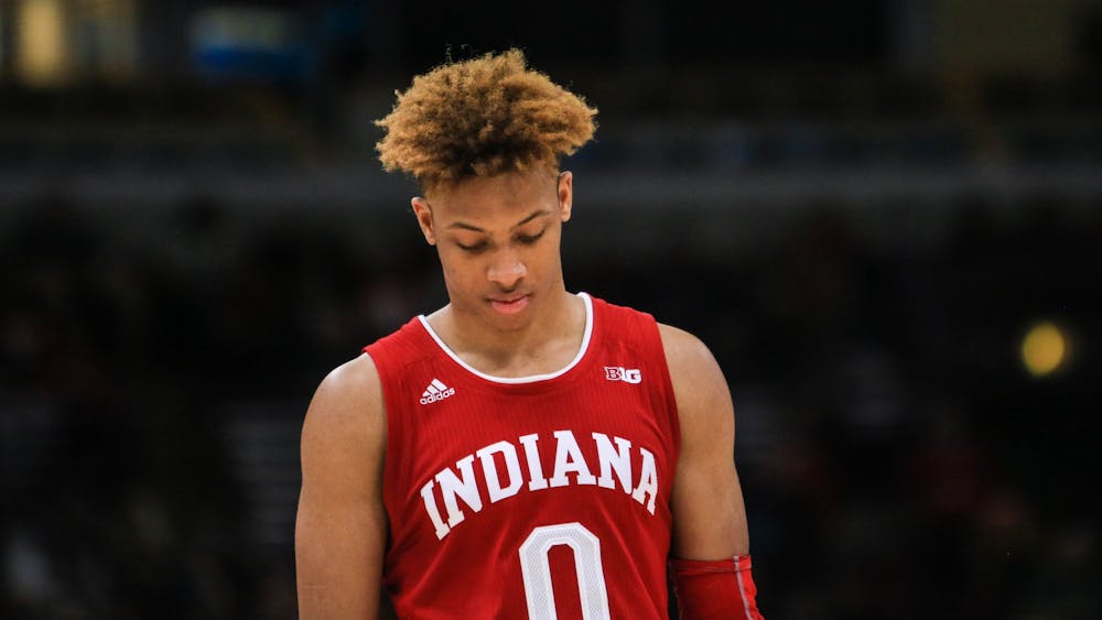 Then-freshman guard Romeo Langford walks back onto the court March 14, 2019, after a timeout during the game against Ohio State during the Big Ten Men&#x27;s Basketball Tournament in Chicago. 