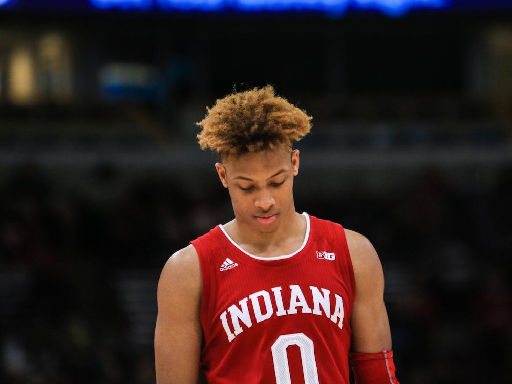 Then-freshman guard Romeo Langford walks back onto the court March 14, 2019, after a timeout during the game against Ohio State during the Big Ten Men&#x27;s Basketball Tournament in Chicago. 