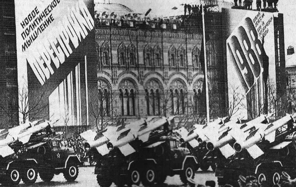 Archive:&nbsp;SA-3 surface-to-air missiles parading through Red Square during the annual celebration of the Bolshevik revolution. The signs in the rear proclaim support for Soviet President Mikhail S. Gorbachev's reforms.