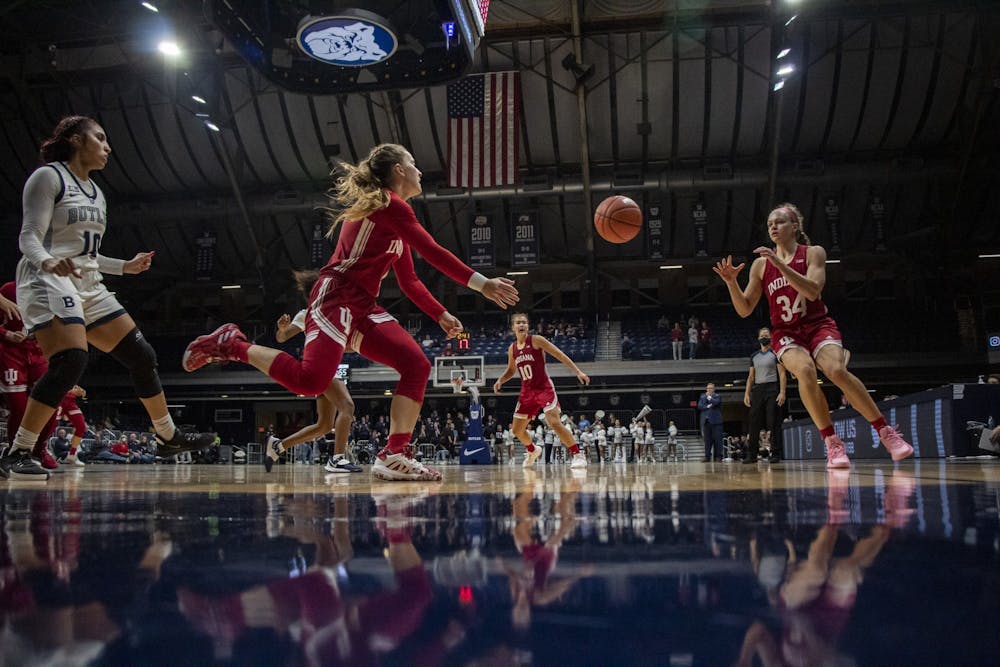 IU graduate guard Nicole Cardaño-Hillary passes the ball to senior guard Grace Berger during the game against Butler University on Nov. 10, 2021, at Hinkle Fieldhouse. Indiana won 86-63 in the first game of the 2021-2022 season.