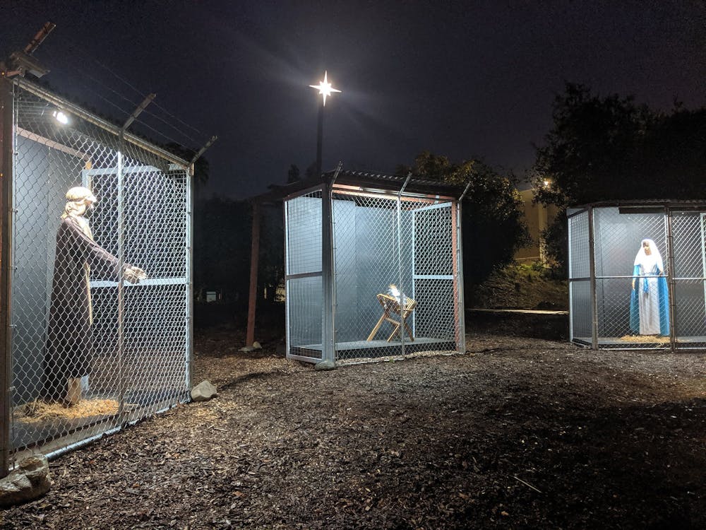 A nativity scene at Claremont United Methodist Church in Claremont, California, depicts the Holy Family separated as refugees in cages.