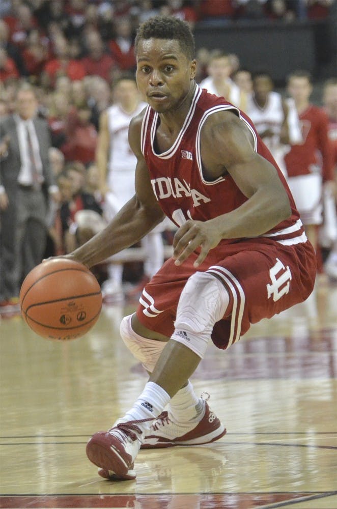 Senior guard Kevin "Yogi" Ferrell drives down the court against Wisconsin on Tuesday at the Kohl Center. The Hoosiers lost 82-79 in overtime.