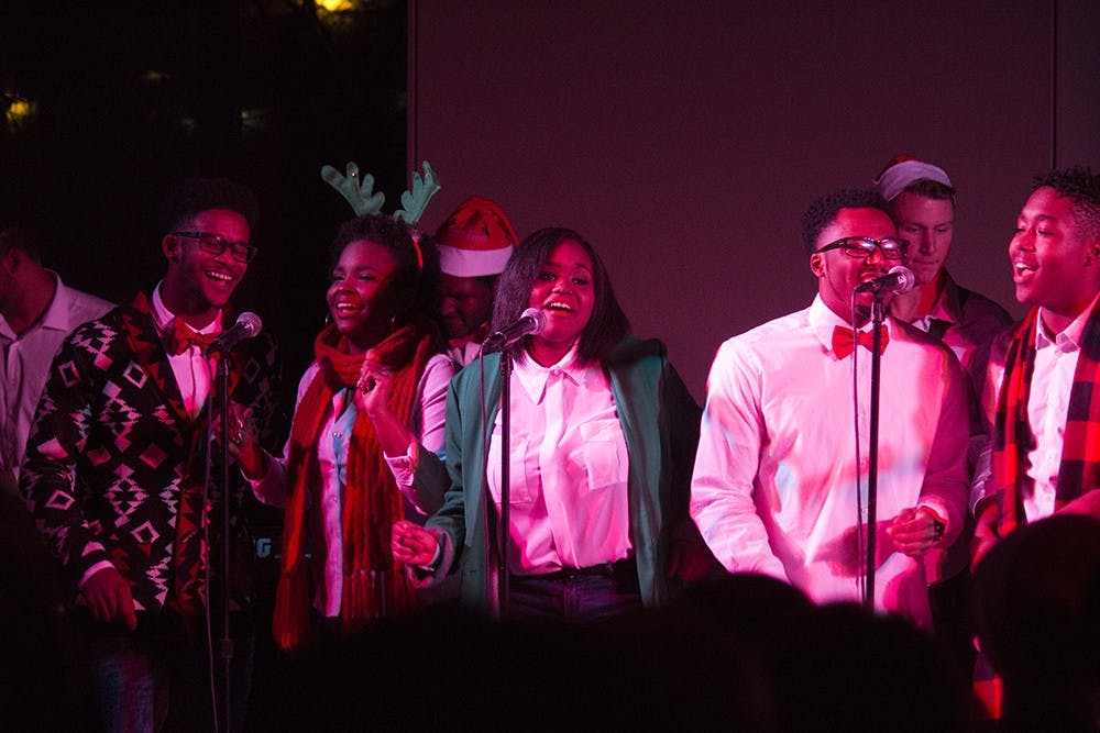 Singers clap and dance to the beat as they perform during IU Soul Revue's Soulful Holiday Concert on Tuesday in the Neal Marshall Black Culture Center Grand Hall on Tuesday.