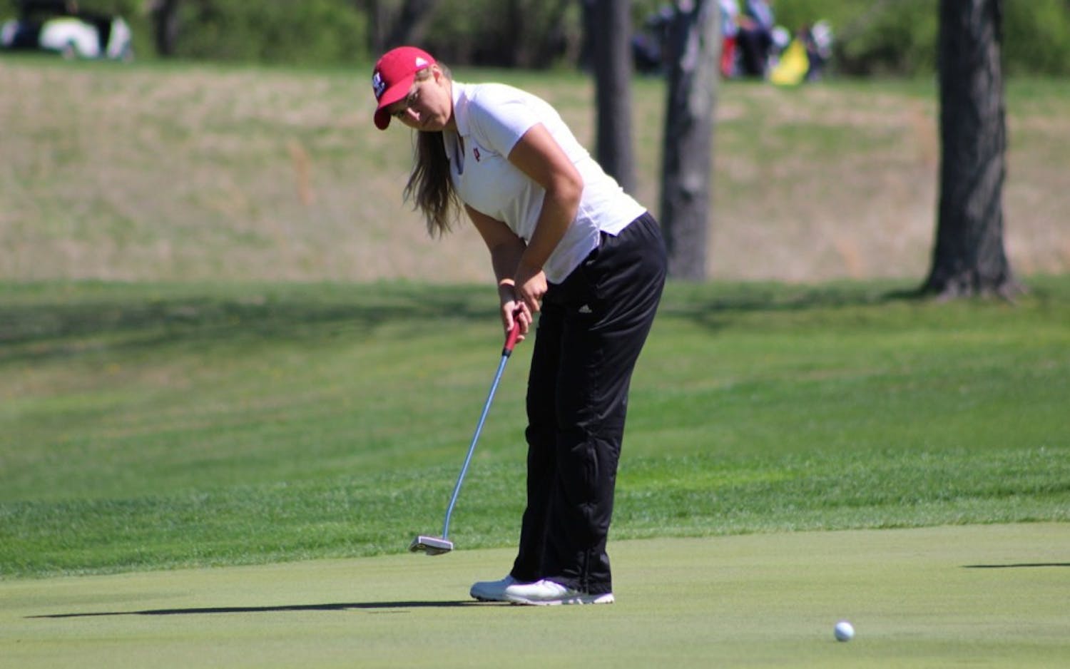 Sophomore Erin Harper putts during the first round of the IU Invitational at IU Golf Course. Harper finished tied for 25th at the Big Ten Championships in Cincinnati, Ohio.&nbsp;