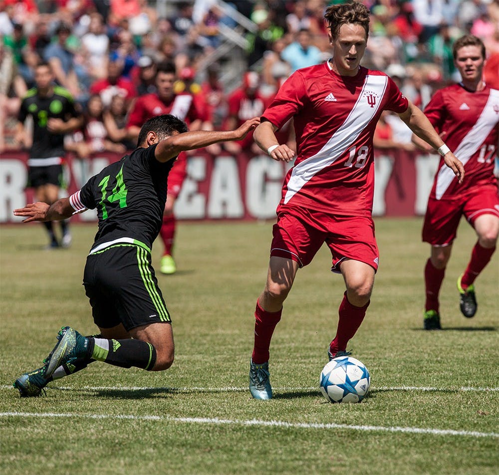 Junior midfielder RIchard Ballard works the ball through the Mexican defense during the first half. Ballard scored the second of IU's two goals during the game, helping them defeat the Mexican U-20 National Team 2-0 Sunday at Bill Armstrong Stadium.