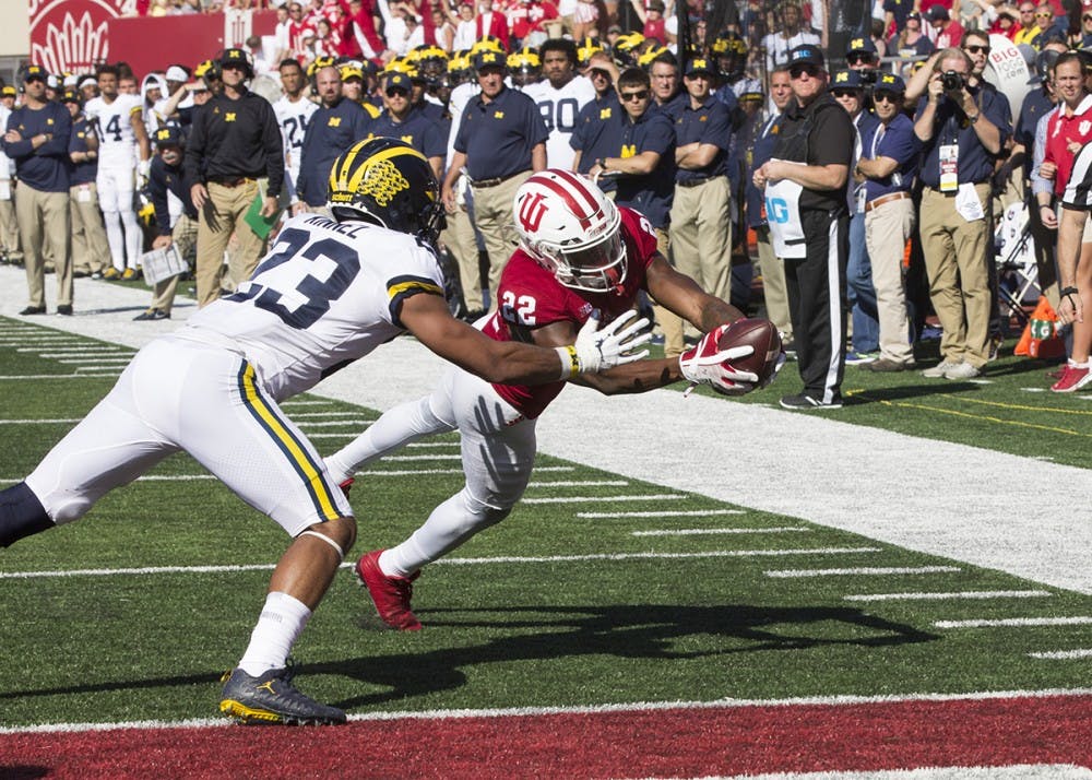 <p>Sophomore wide receiver Whop Philyor catches a touchdown pass for IU in the fourth quarter against Michigan on Oct. 14.</p>