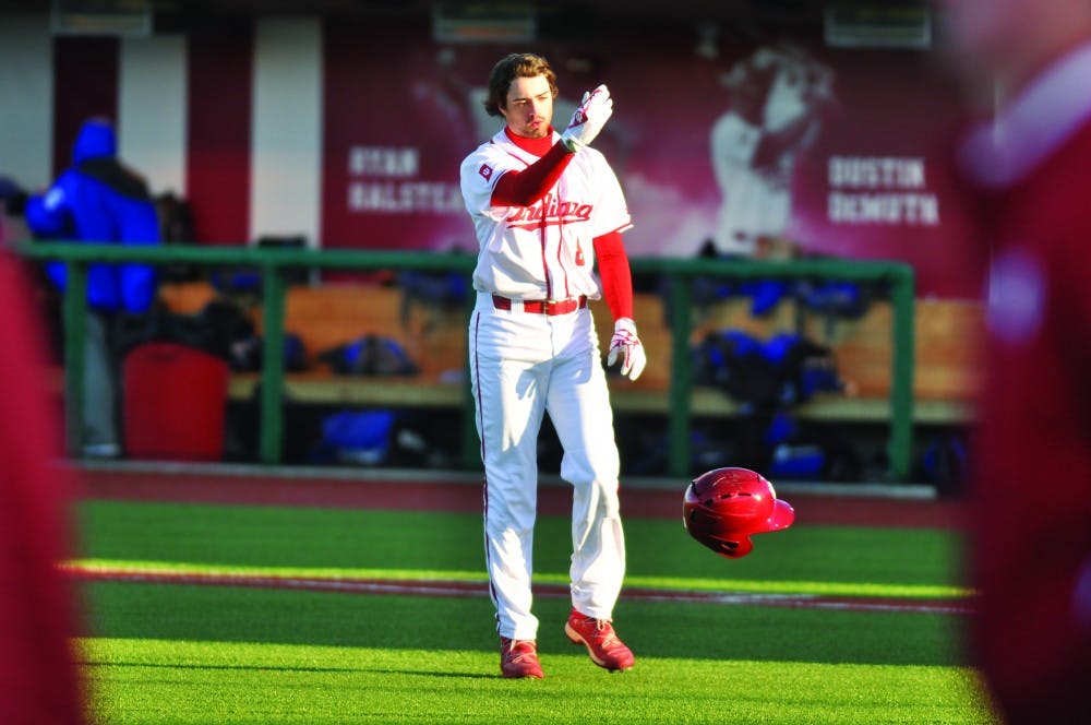Sophomore Tony Butler tosses his helmet towards the dugout after grounding out to end IU’s first home game. The Hoosiers lost to Middle Tennessee State 5-3.