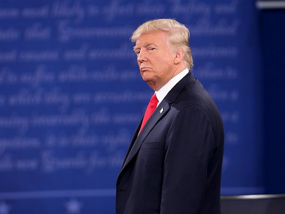 President Donald Trump stands on stage during a presidential debate Oct. 9, 2016, at Washington University in St. Louis, Missouri.
