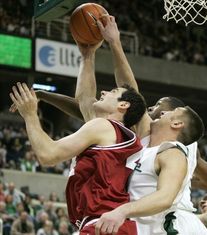 Senior forward Kyle Taber has a shot contested by Michigan State's Goran Suton during the first half of IU's game vs. Michigan State in East Lansing, Mich.