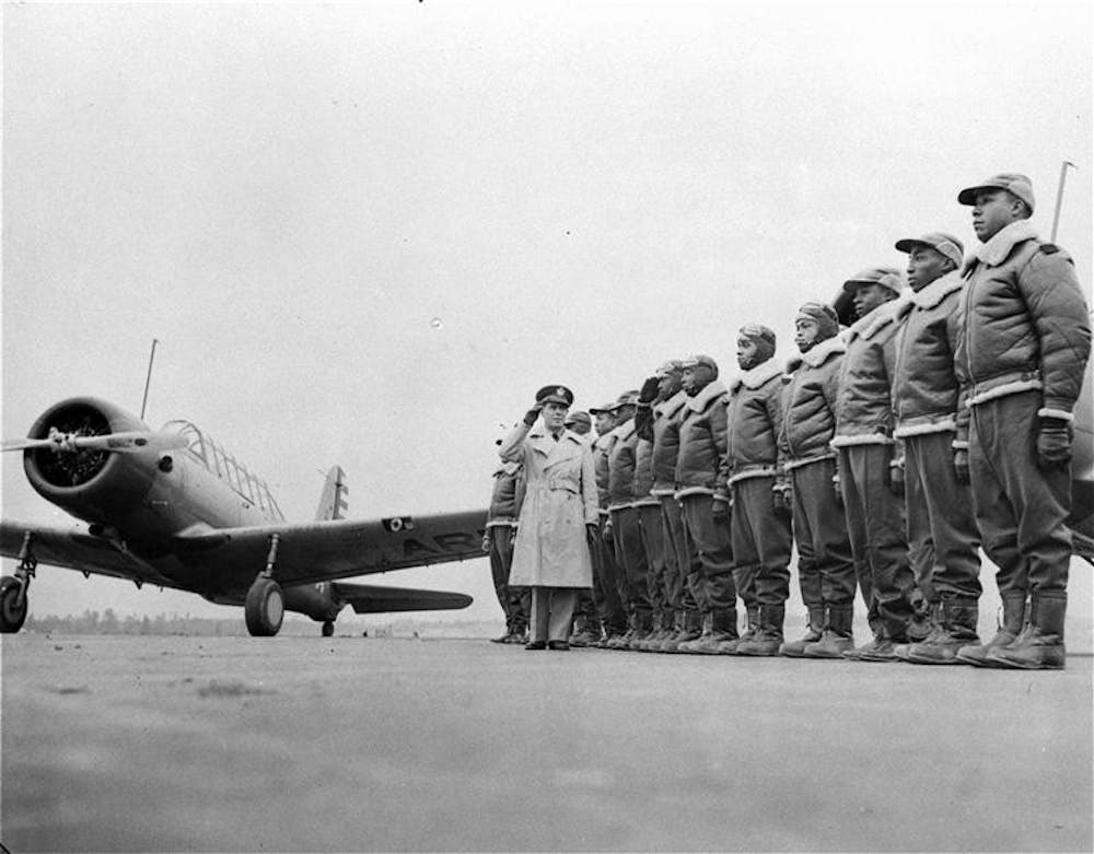 Major James A. Ellison, left, returns the salute of Mac Ross of Dayton, Ohio, as he inspects the cadets at the Basic and Advanced Flying School for black United States Army Air Corps cadets on Jan. 23, 1942 at the Tuskegee Institute in Tuskegee, Ala. The Tuskegee Airmen, a group of black pilots who fought in World War II, have been invited to attend President-elect Barack Obama's inauguration.