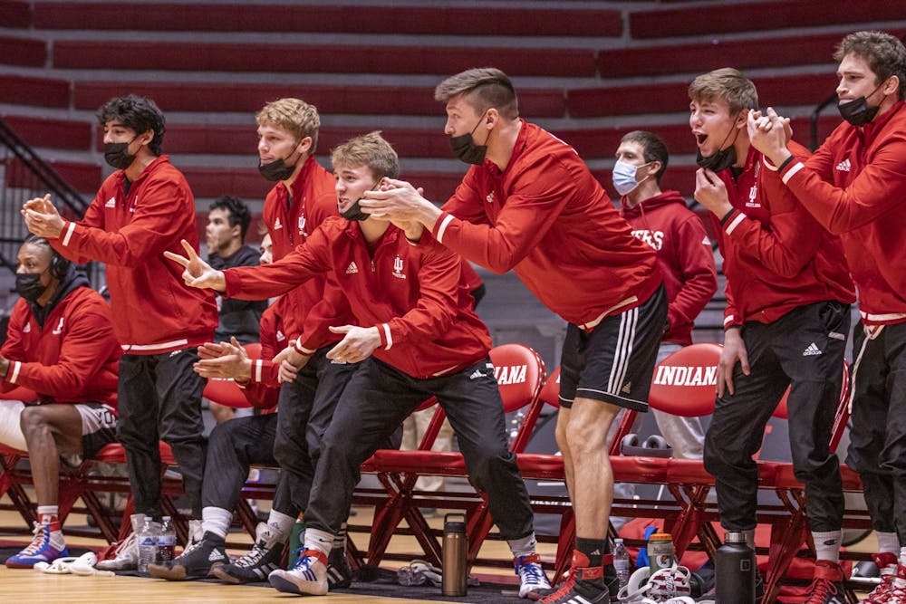 <p>Members of the Indiana wrestling team celebrate during a match against Michigan State on Jan. 17, 2022, at Wilkinson Hall. CJ Red and his father Chad Red Sr. were inducted into the Indiana High School Wrestling Coaches Association Hall of Fame.</p>