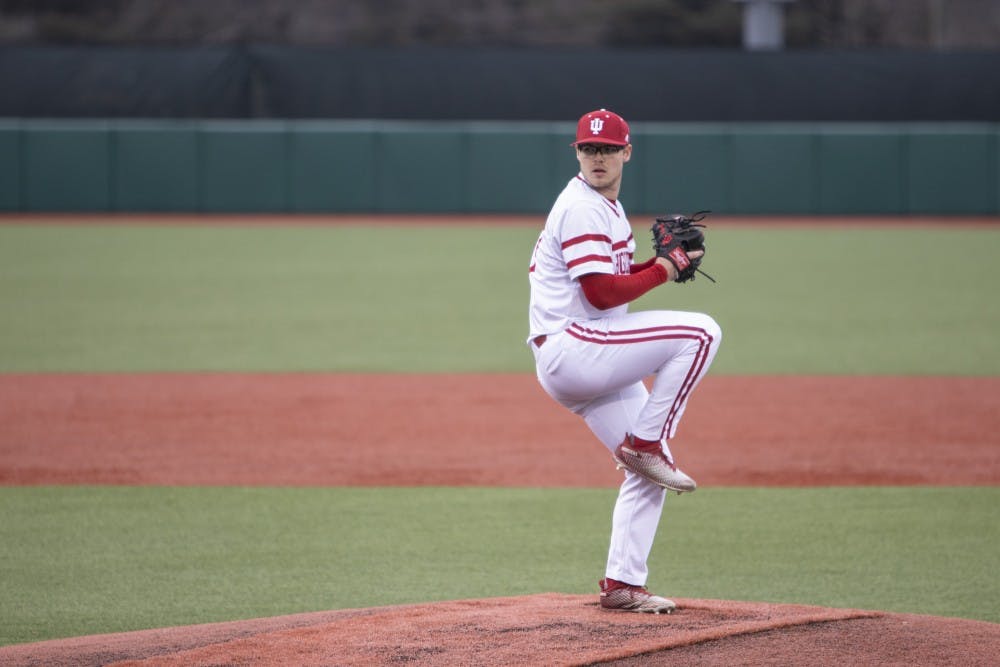 <p>Junior left-hand specialist Andrew Saalfrank prepares to pitch Feb. 27 at Bart Kaufman Field. IU played Butler University and won, 9-3.</p>