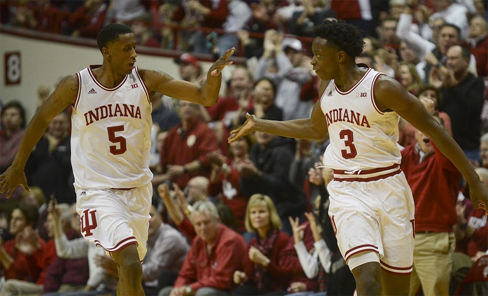 Junior forward Troy Williams (5) high fives freshman forward O.G. Anunoby (3) after Anunoby made a three-point basket during the game against Wisconsin on Jan. 5 at Assembly Hall. The Hoosiers won, 59-58.