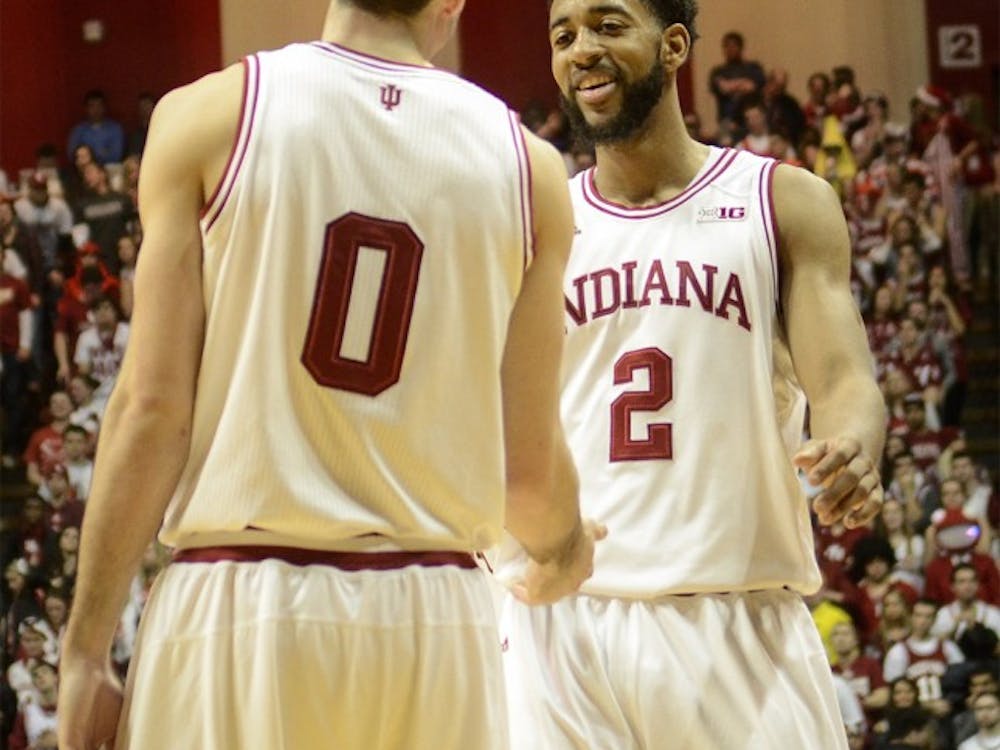 Junior forward Will Sheehey and senior forward Christian Watford talk with one another during the Hoosiers' 81-73 win against Michigan on Feb. 2, 2013 at Assembly Hall.