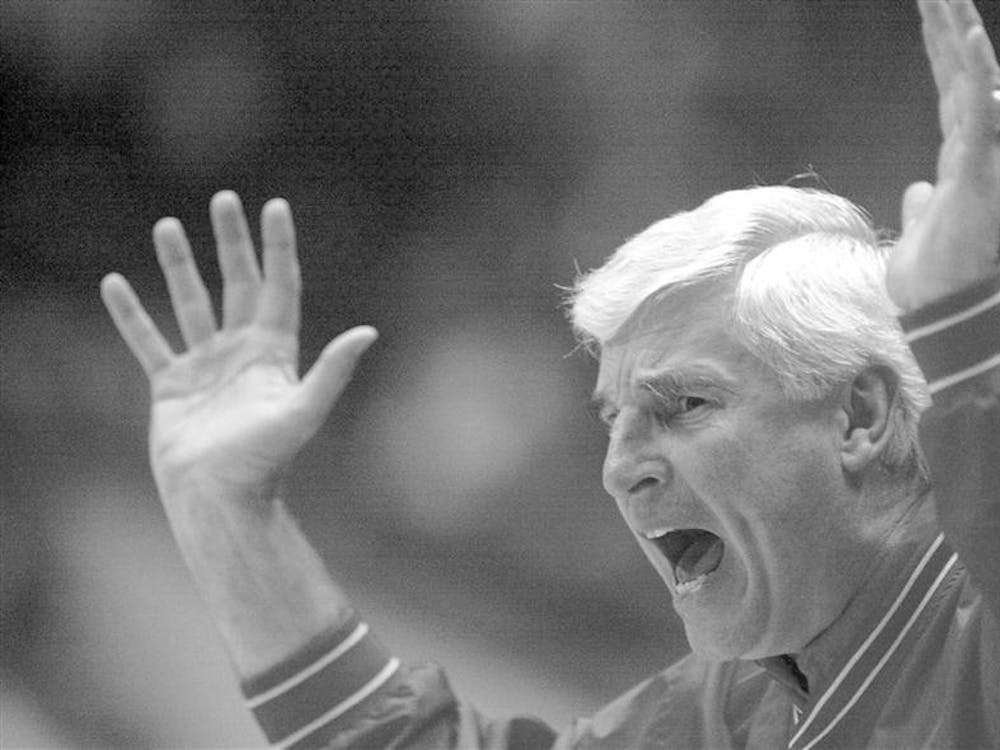 Former head basketball coach Bob Knight reacts to a game in Bloomington, Ind., on March 15, 2000.