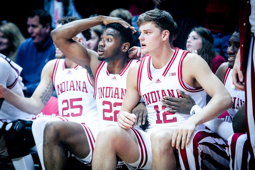 <p>Sophomore Jordan Geronimo and graduate student Miller Kopp react to a Trayce Jackson-Davis dunk in the first half Jan. 22, 2023, at Simon Skjodt Assembly Hall in Bloomington, Indiana. The Hoosiers beat Minnesota 61-57 Wednesday night.</p>