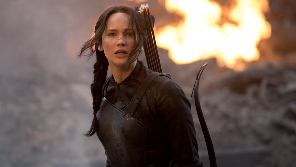 Jennifer Lawrence is pictured playing Katniss in the 2014 movie &quot;The Hunger Games:﻿ Mockingjay - Part 1&quot;. There are a total of four movies in The Hunger Games series with the third novel, “Mockingjay,” being split into two.